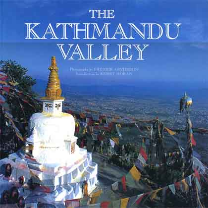 
Prayer flags encircle the Buddhist shrine of Nagarjun Stupa to the north of Kathmandu - The Kathmandu Valley book cover
